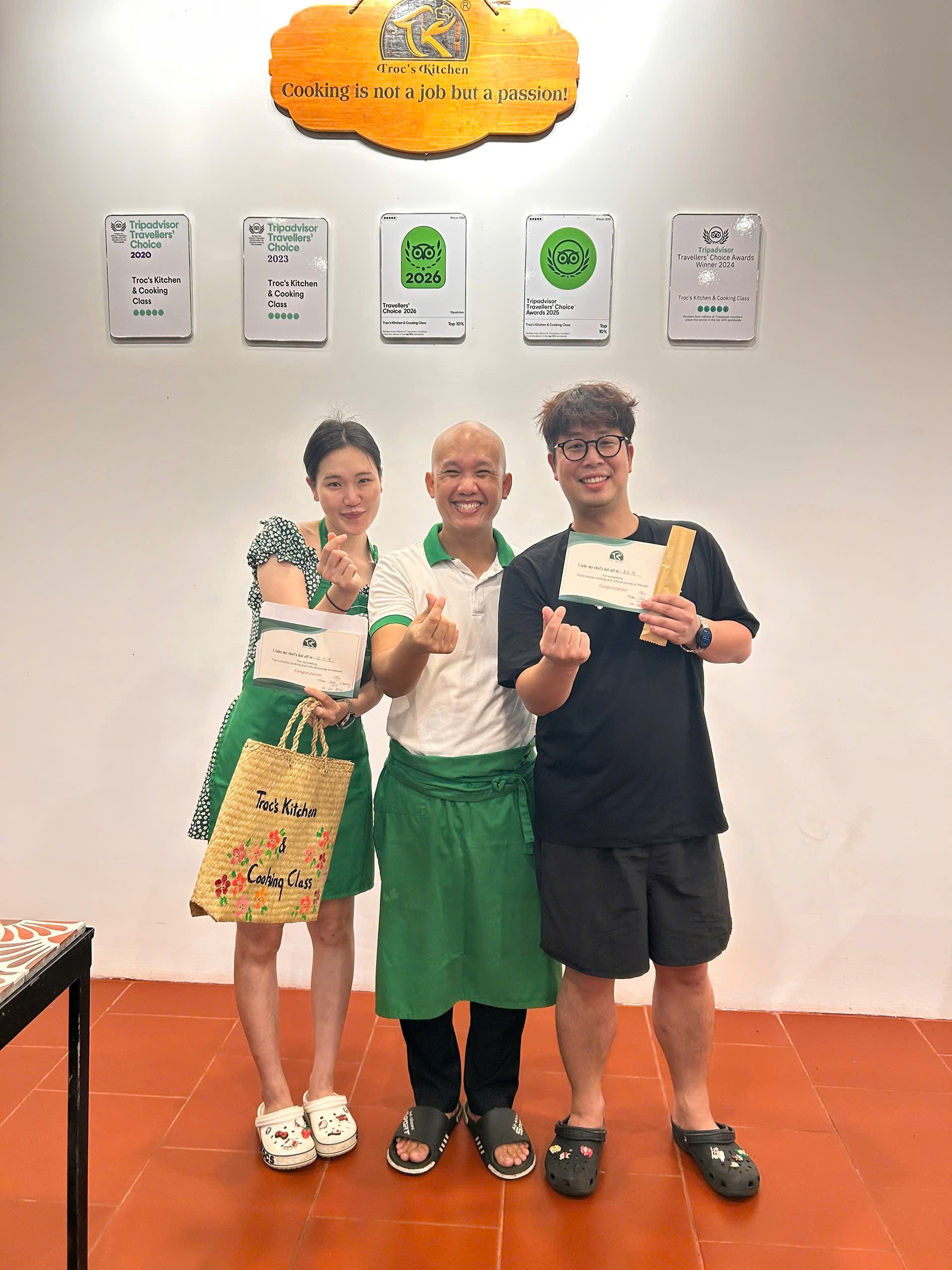 Guests receiving cooking class certificates