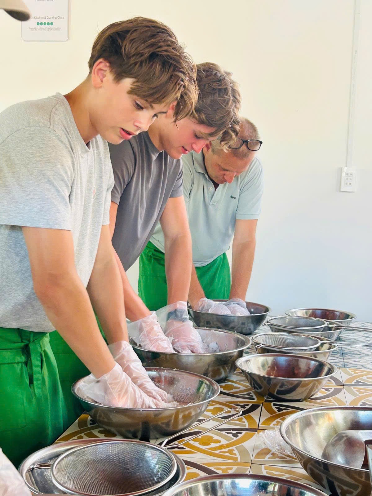 Guests cooking together in a small Vietnamese cooking class